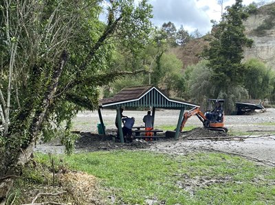 Workers cleaning up Tōtara Reserve